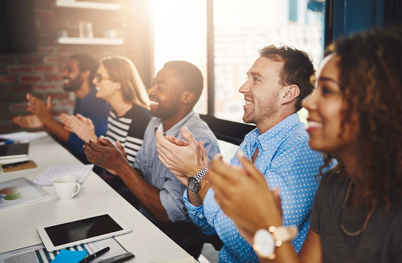 group of people applauding after a seminar