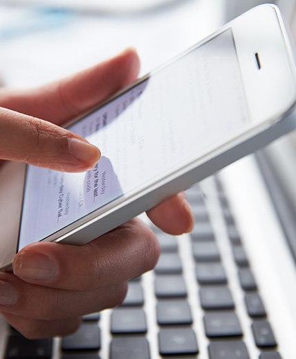 Close up image of hands using a mobile phone