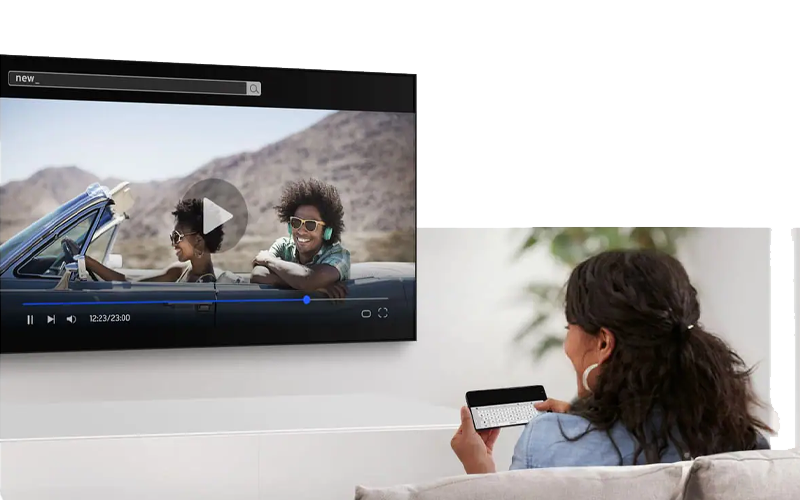 Woman using a Samsung TV and smartphone