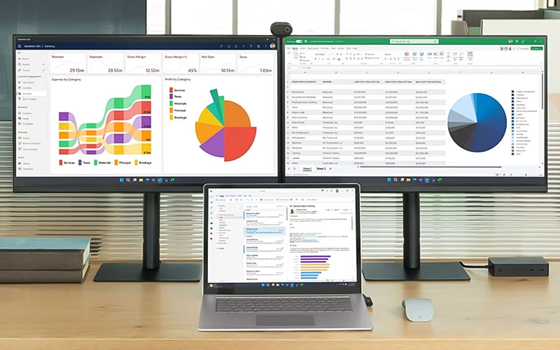 Laptop connected to two monitors