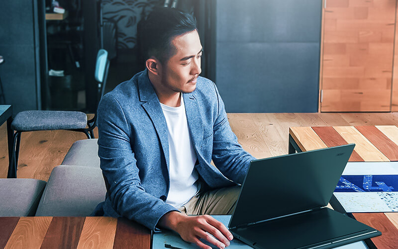 Business professional working off touch screen Acer device