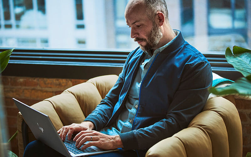 Man working using hp laptop